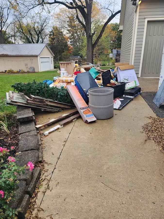 Dumpster being loaded with debris for Roofing Dumpster Rental in Elizabethtown